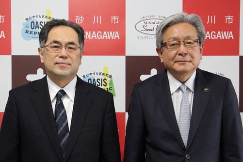 石川伸札幌開発建設部部長(写真左)